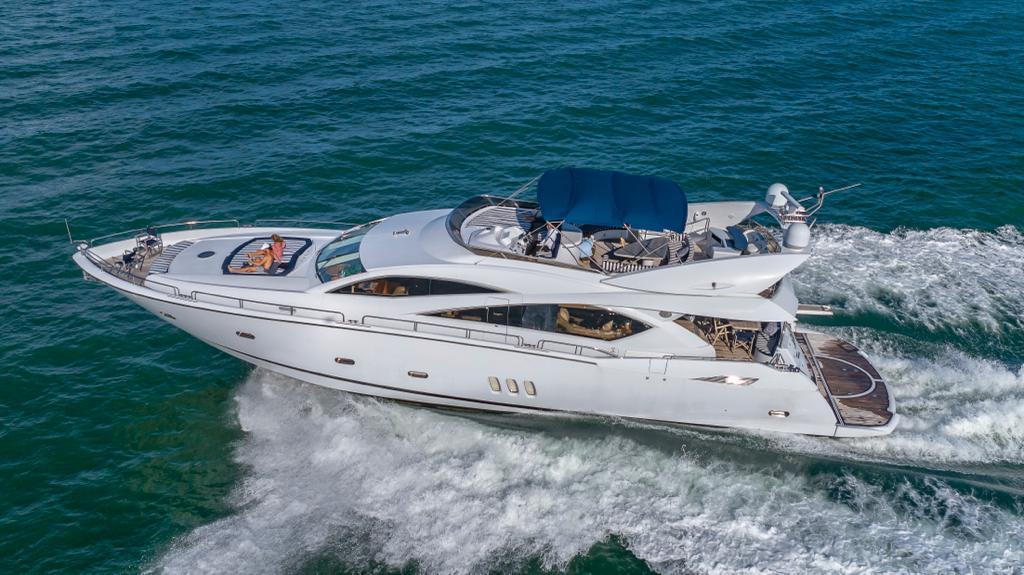 Outdoor dining setup on deck of 84 ft Sunseeker yacht Miami