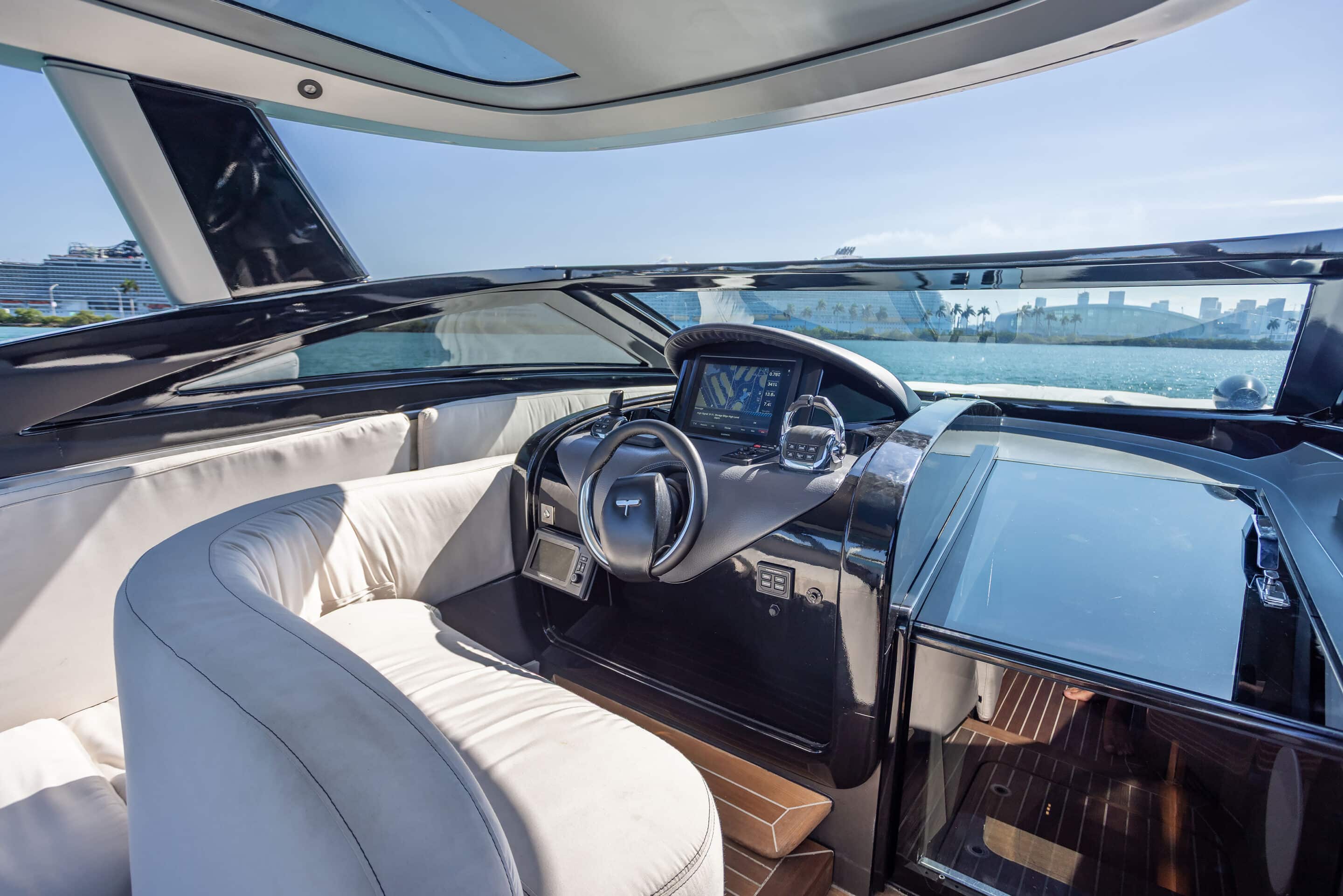 Outdoor dining setup on deck of 55 ft Tecnomar Evo yacht Miami