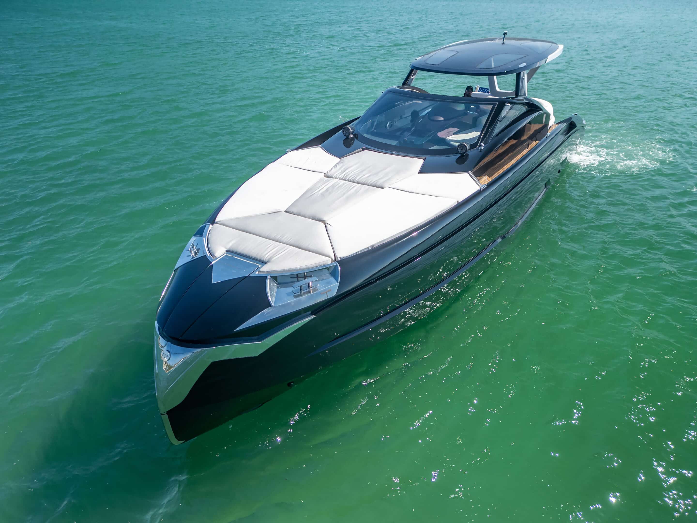 55 ft Tecnomar Evo charter yacht anchored near South Beach Miami